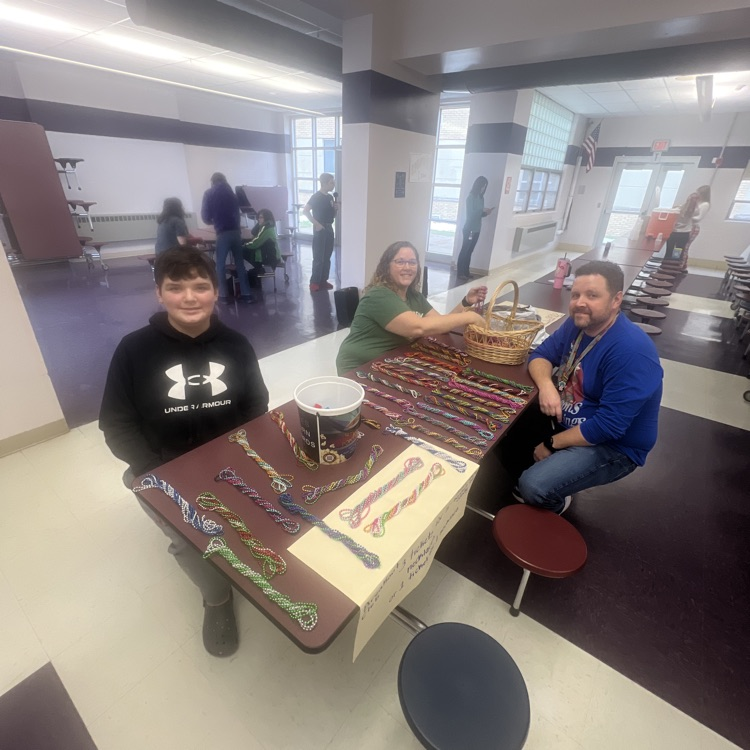 teachers and students selling items for paper tock scissors.