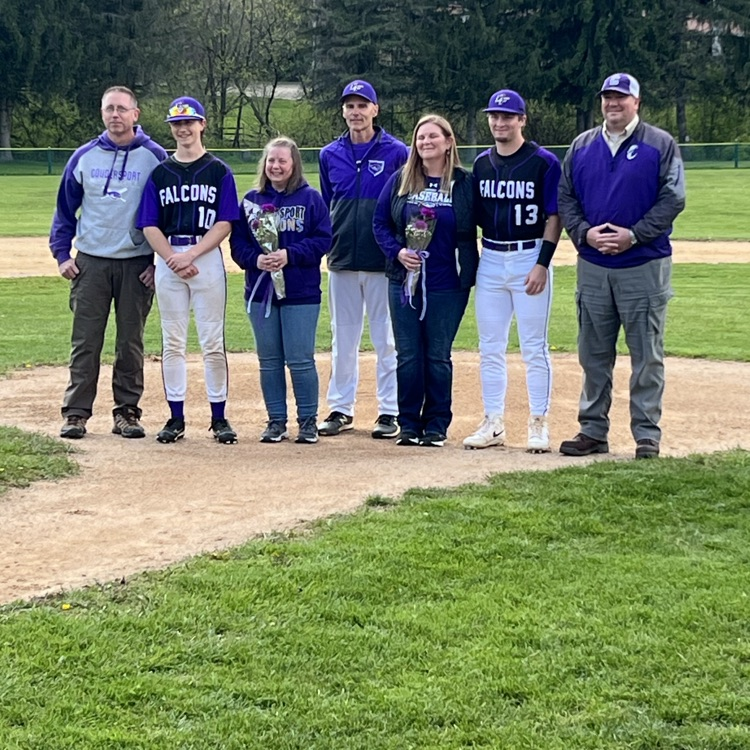 Senior baseball players and their parents and coach.