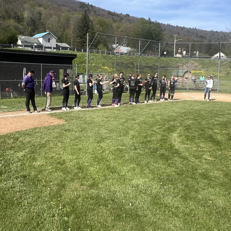 softball players in a line congratulating a sr 