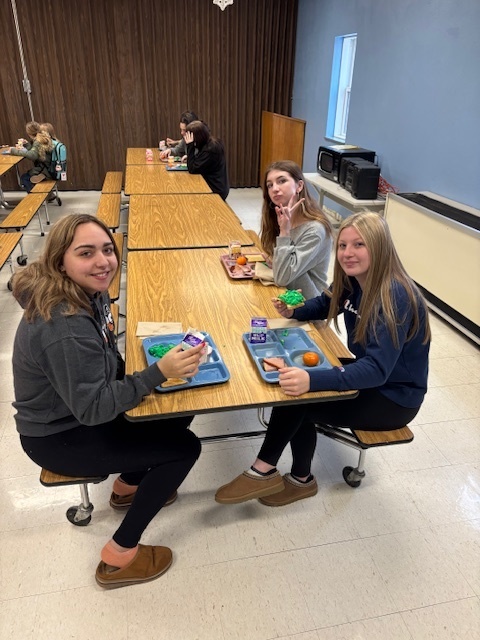 High school students enjoying green eggs and ham.
