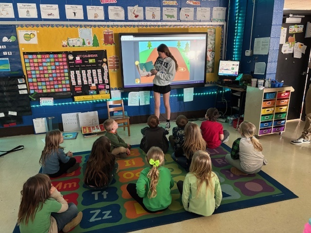 Eva reading Green Eggs and Ham in Kindergarten