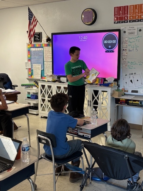 Jase reading Green Eggs and Ham to 5th grade