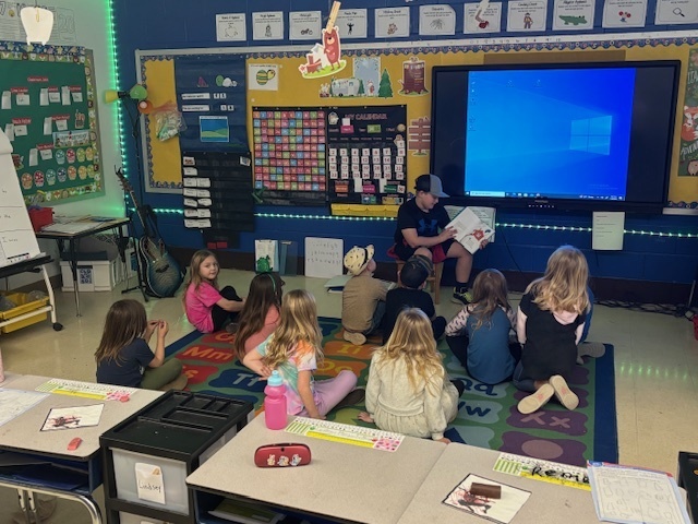 Easton reading Cat in the Hat to Kindergarten