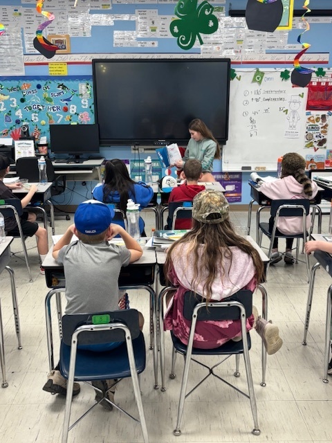 Eva reading Cat in the Hat to 4th grade
