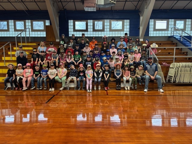 Elementary students wearing their hats.