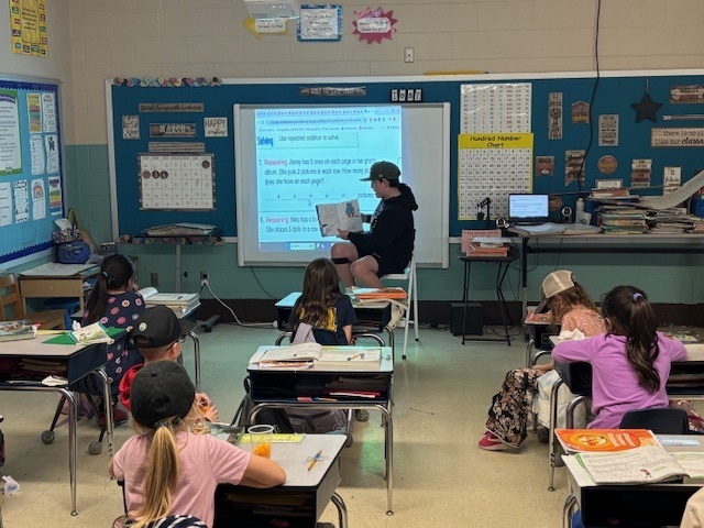 Jaxson reading to 2nd grade