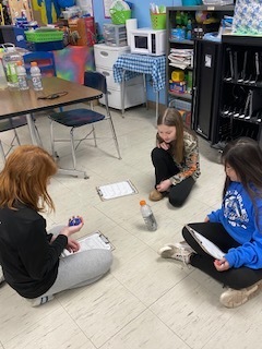 Fourth Grade: Khilyn, Kynlee, and Peyton mastering the bottle flip activity in math class! 