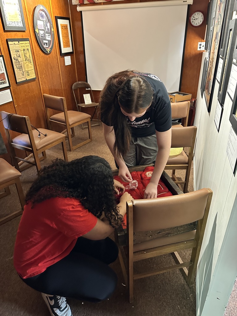 Students work on a display for the Coulterville School section of the museum.