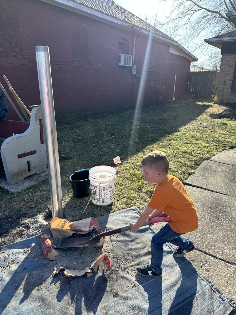 A little helper showed up after hours to help put concrete in the hole!