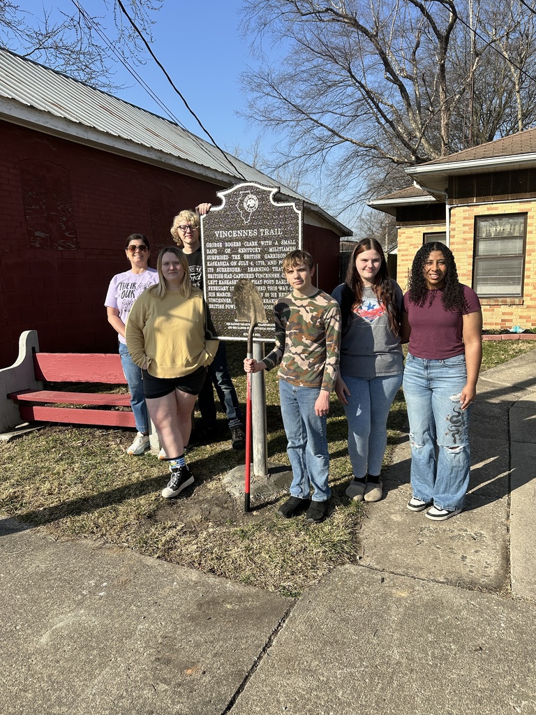 Third hour Local History students show off the placed landmark sign on the museum grounds.