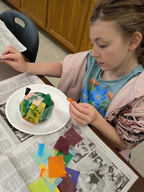 Concentrating on making her egg how she wants it