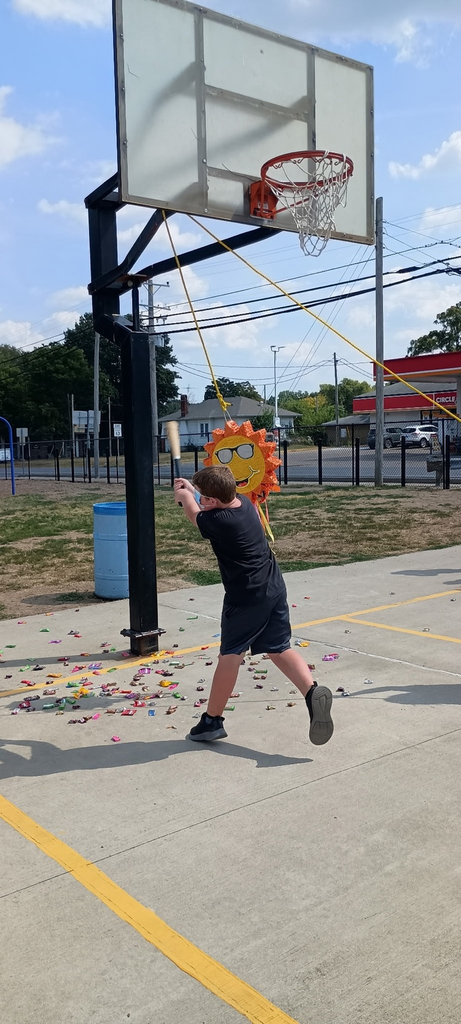 students enjoying a piñata