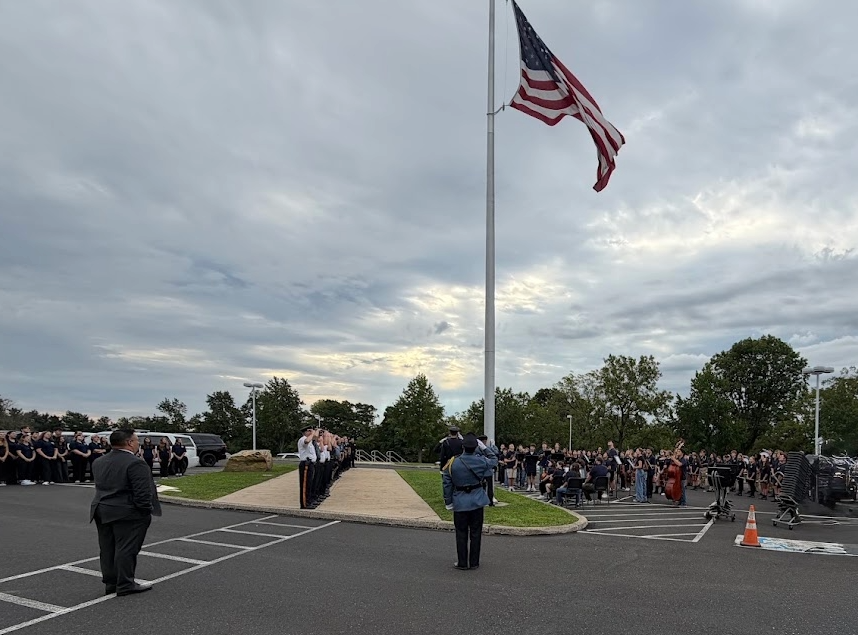 Students and First Responders looking at the American flag