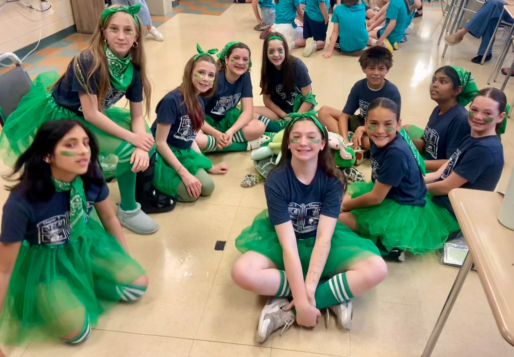 group of students who participated in Reading Olympics posing in a circle