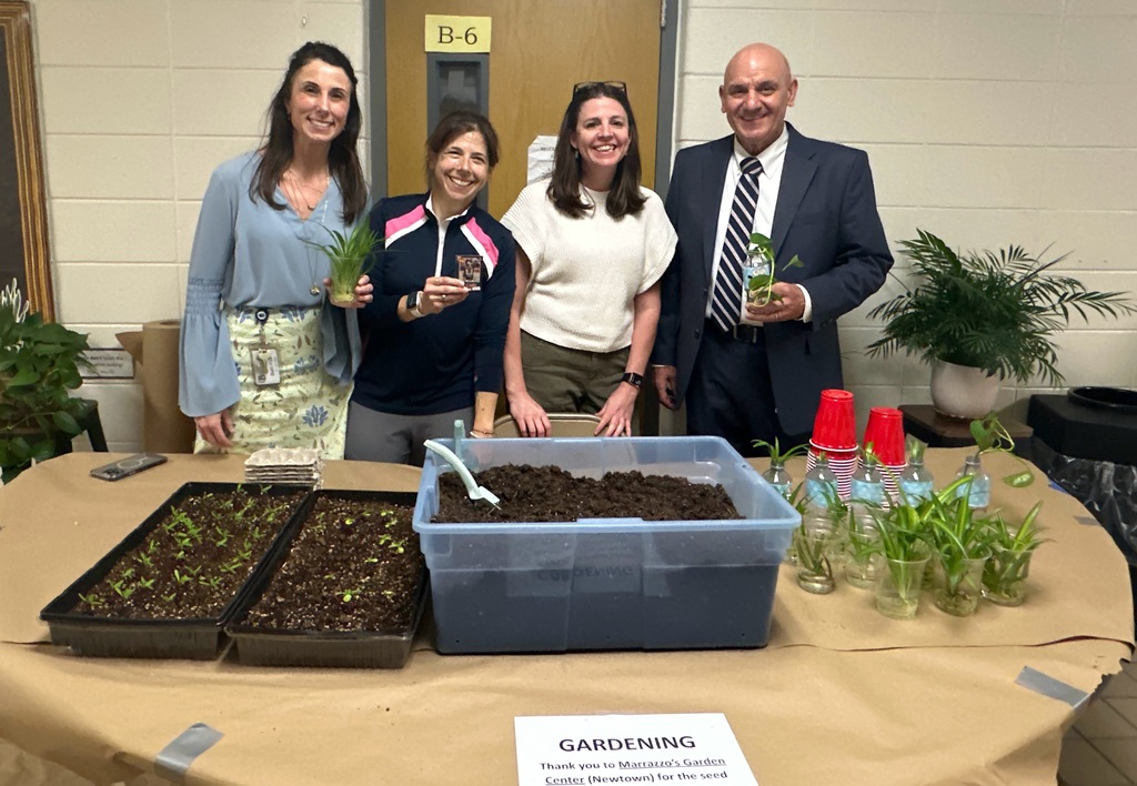 Staff handing out plants for the event