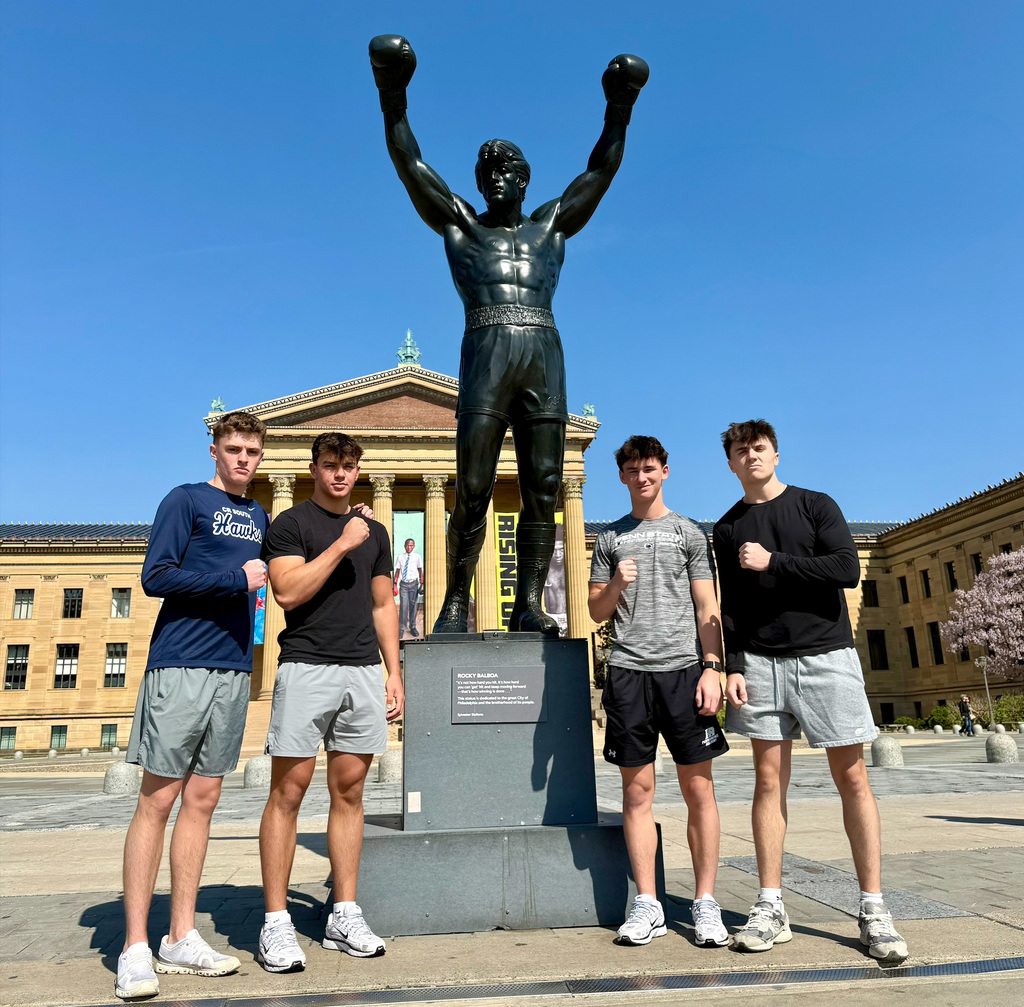 students with the rocky sculpture