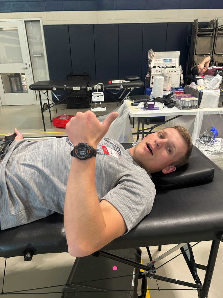 staff member giving a thumbs up after donating blood