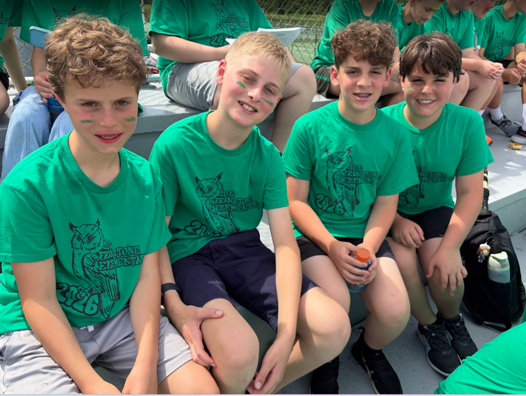 students waiting to participate in the 6th grade track meet