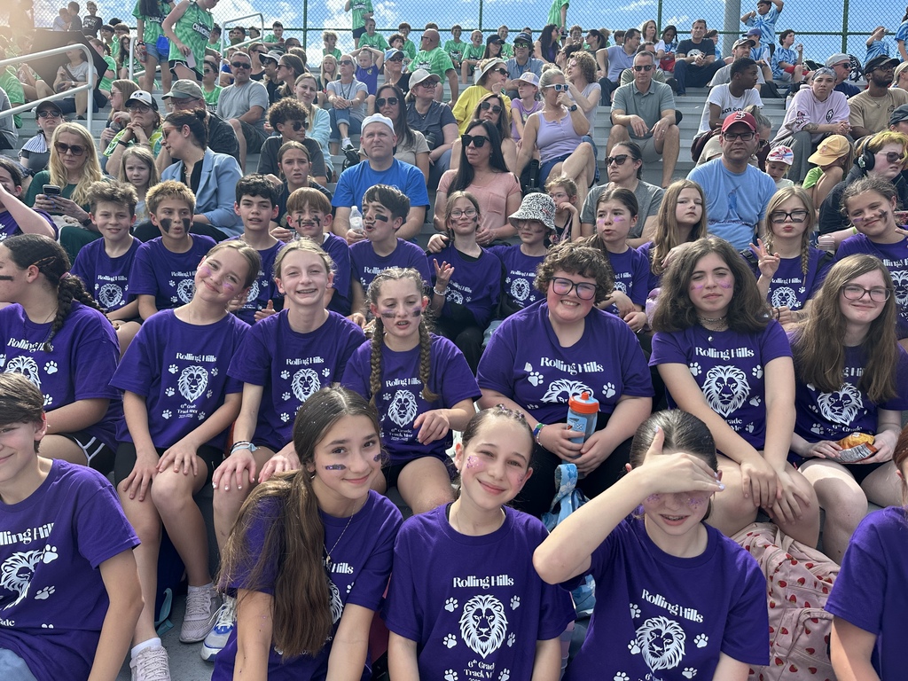 students smiling at the 6th grade track meet