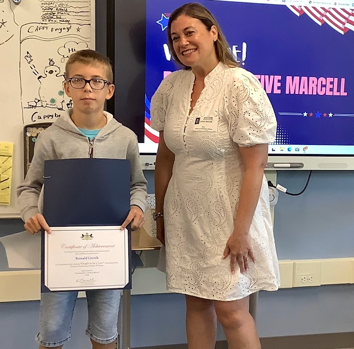 Student and Representative Marcell celebrating student's acheivement