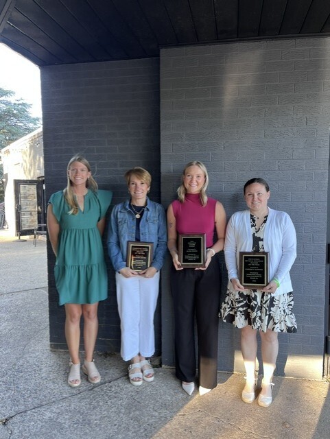 Group posing after receiving an award from Shape PA