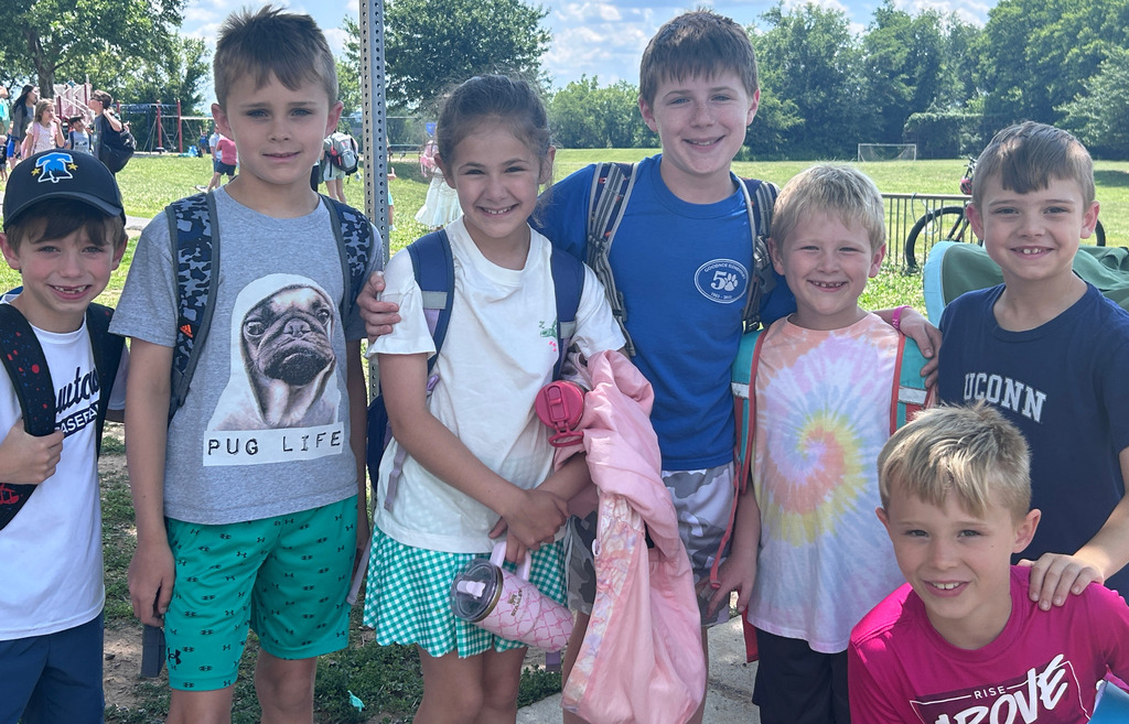 Students smiling for the last day of school