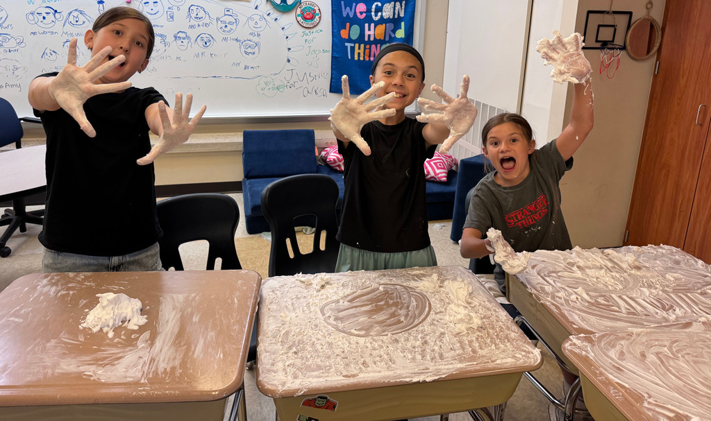 students cleaning their desks