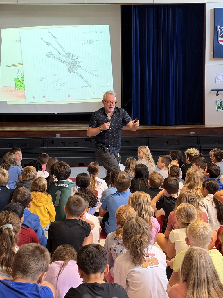 Students watching an authors presentation