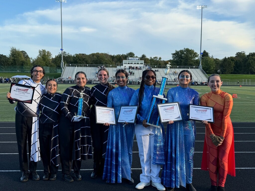 Smiling students who are presenting their awards for Council Rock South Marching Band