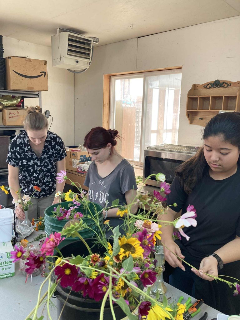 students arrange flowers