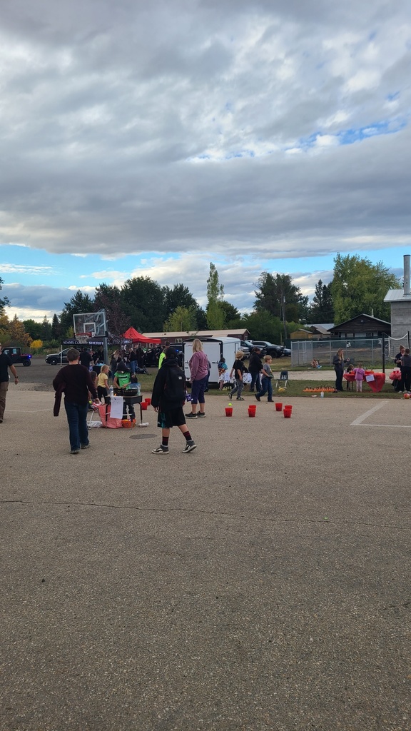 children play games in front of elementary school