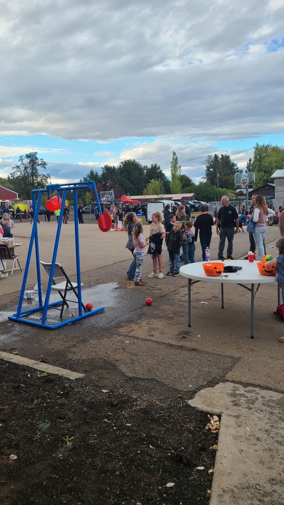 children play games in front of elementary school