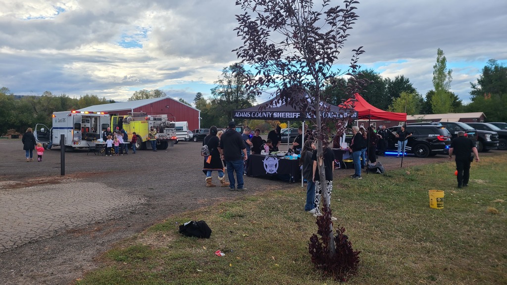 People stand near booths