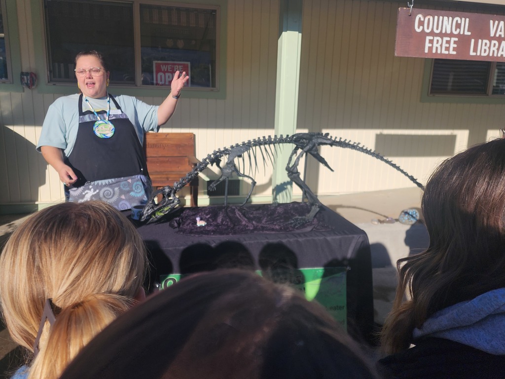 woman speaks in front of students