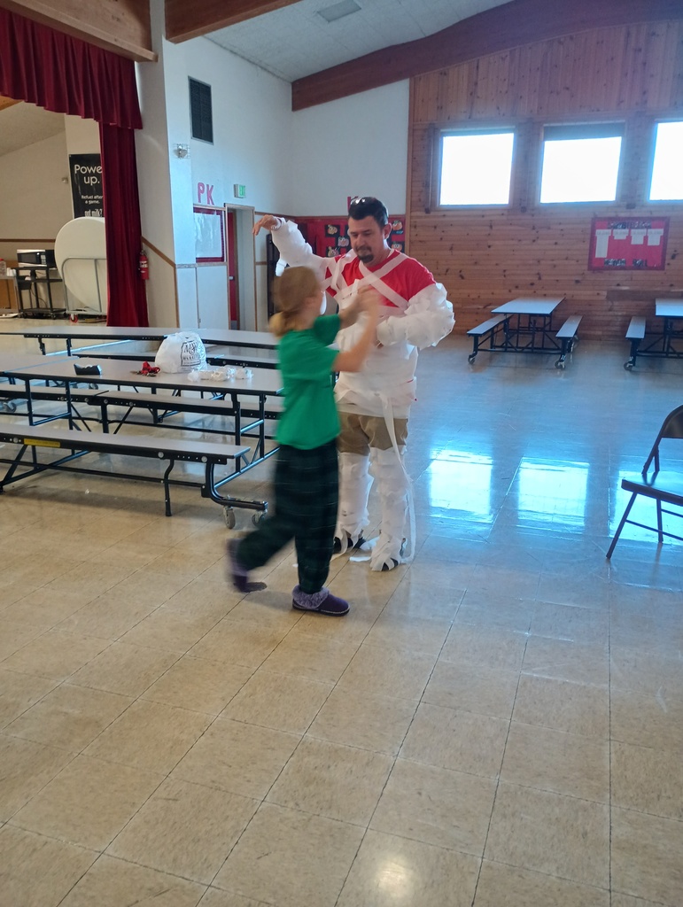 students tie wrap around man