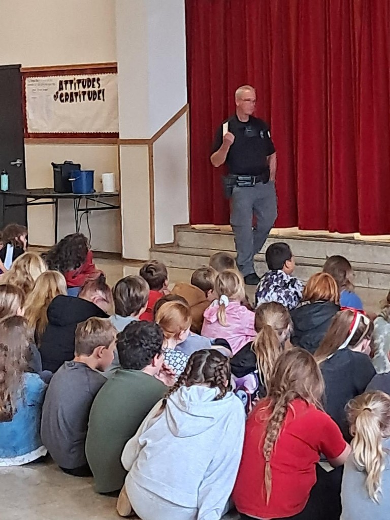 Officer in front of children