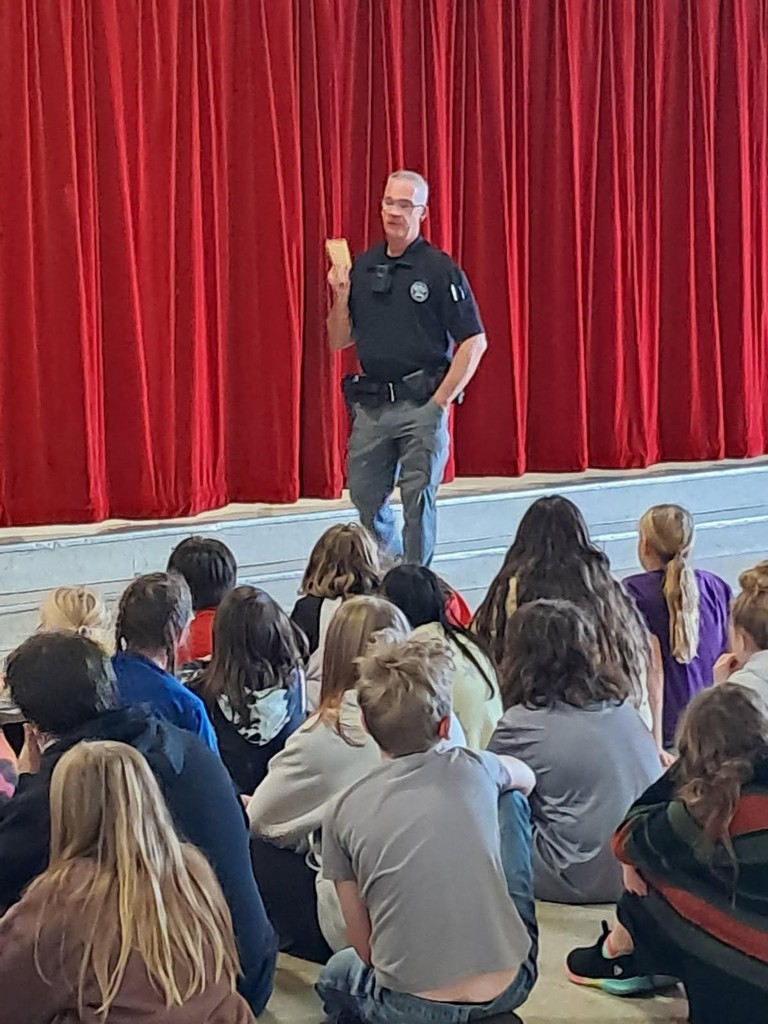 Officer in front of children