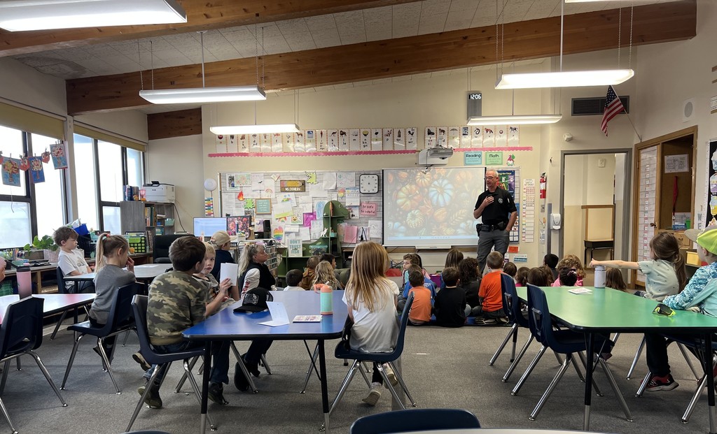Officer speaking in a classroom