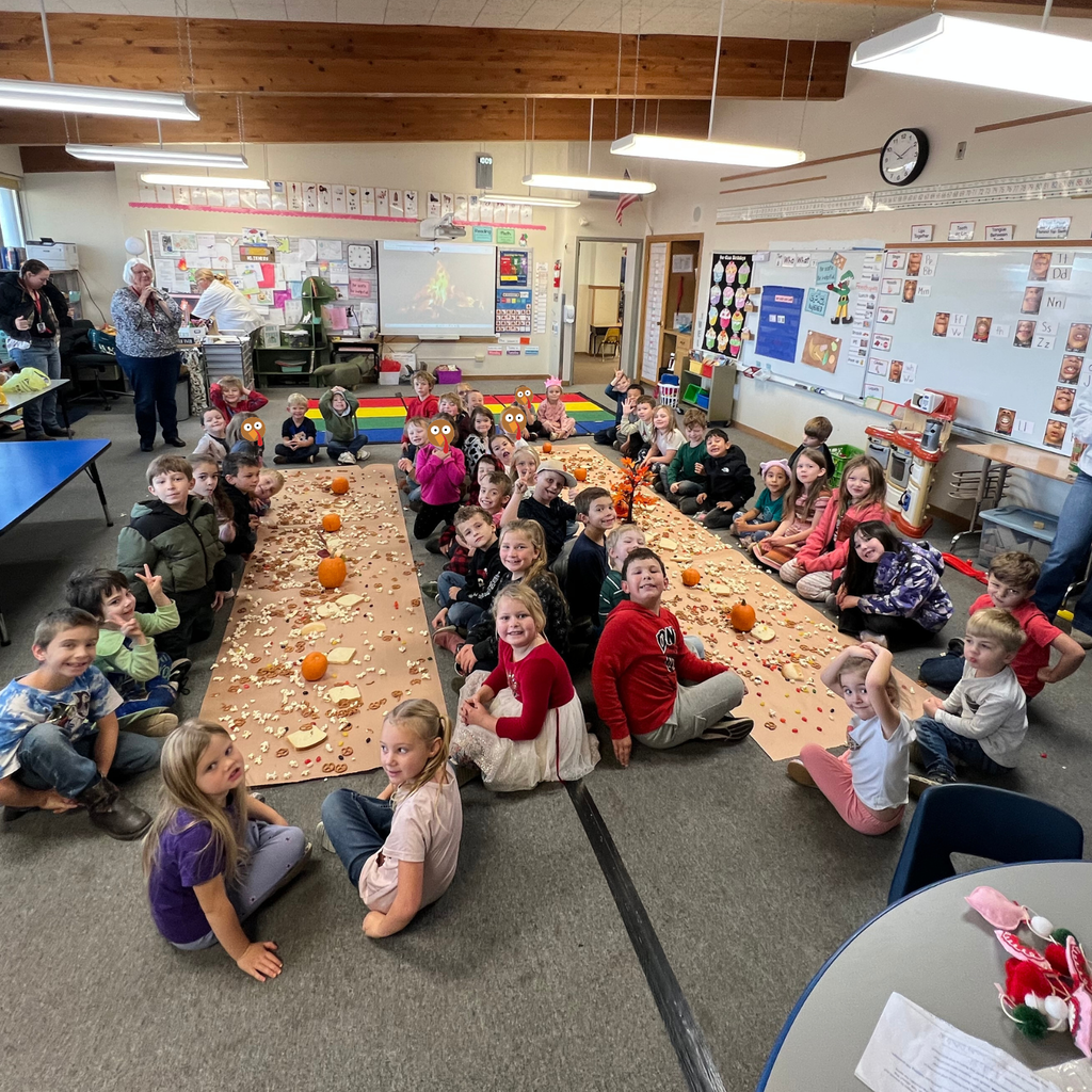 children sit on floor