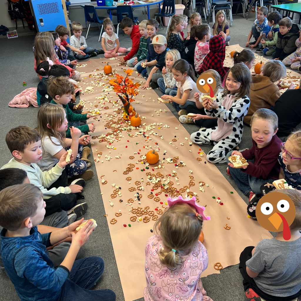 children sit around Thanksgiving spread
