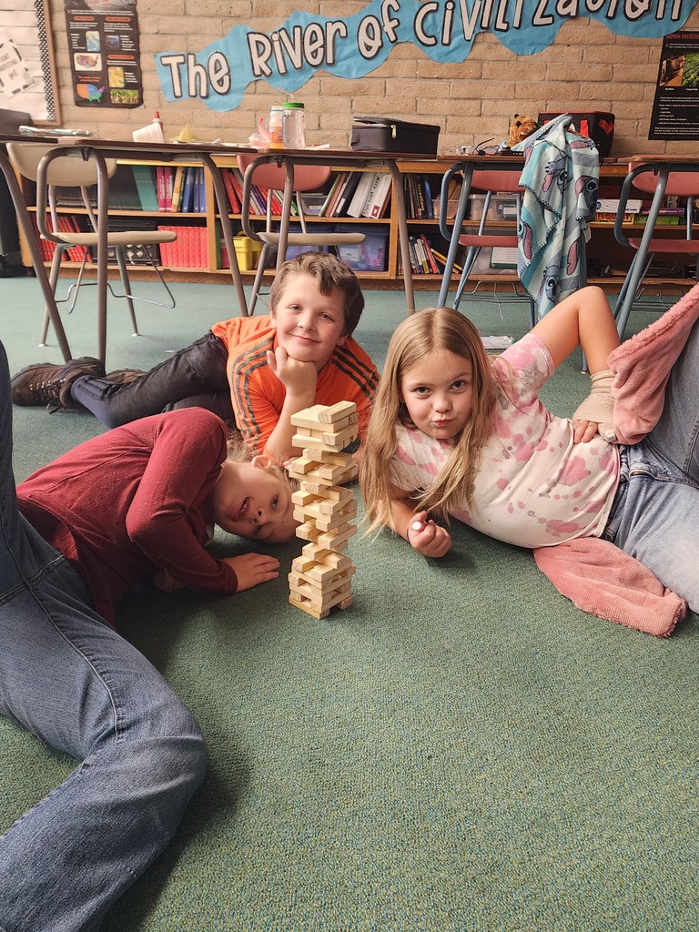 students play Jenga