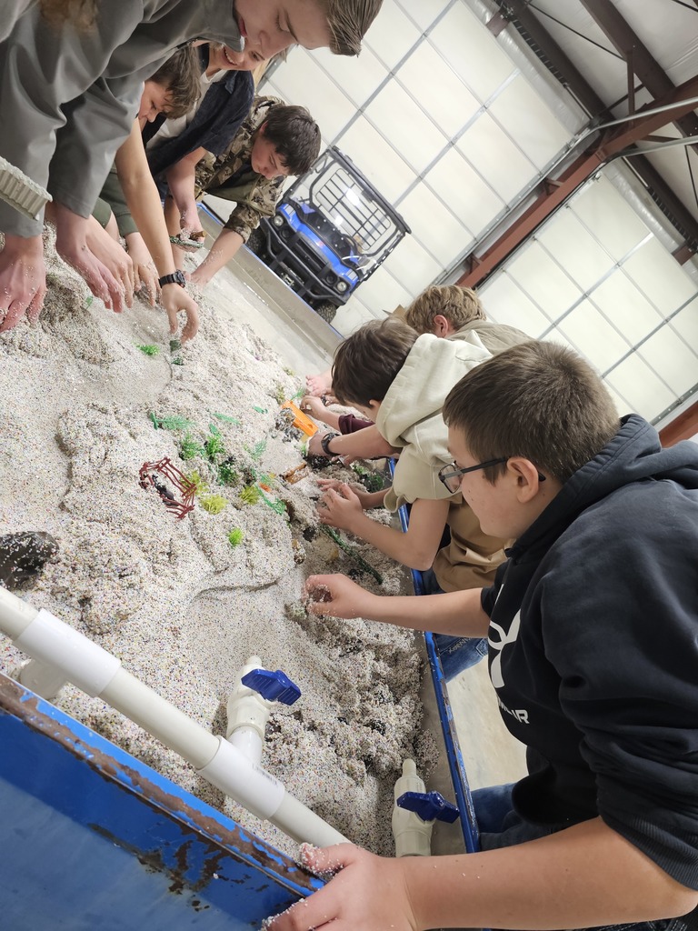students examine hydrology table
