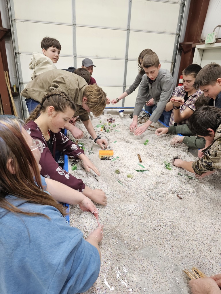 students examine hydrology table