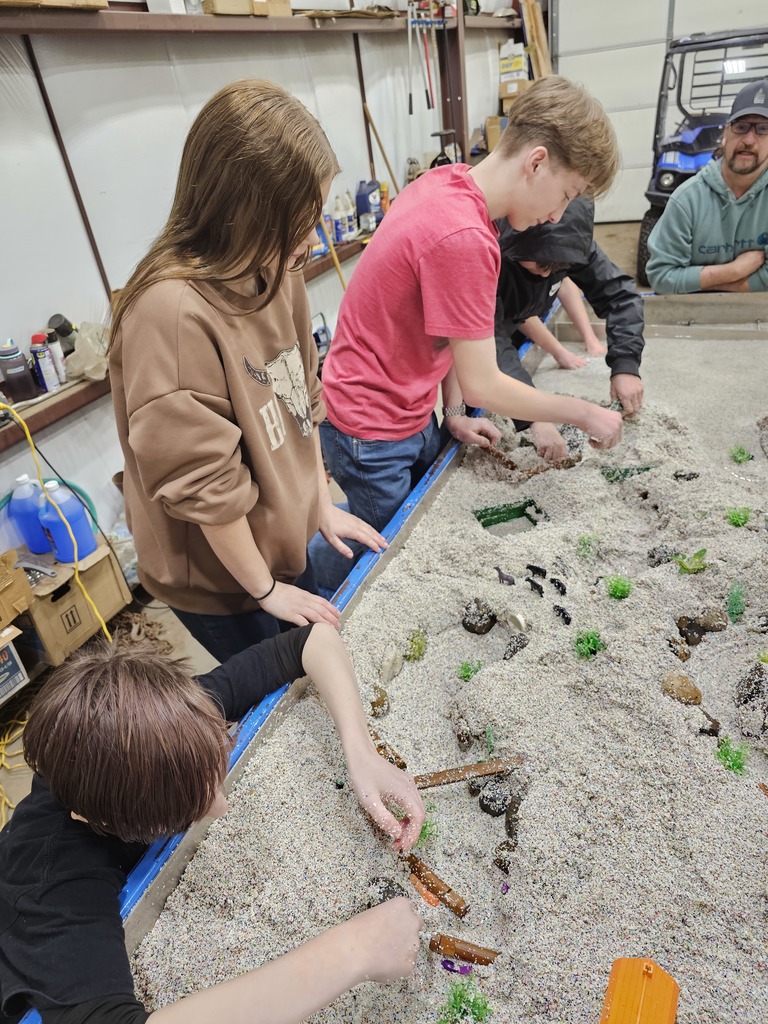 students examine hydrology table