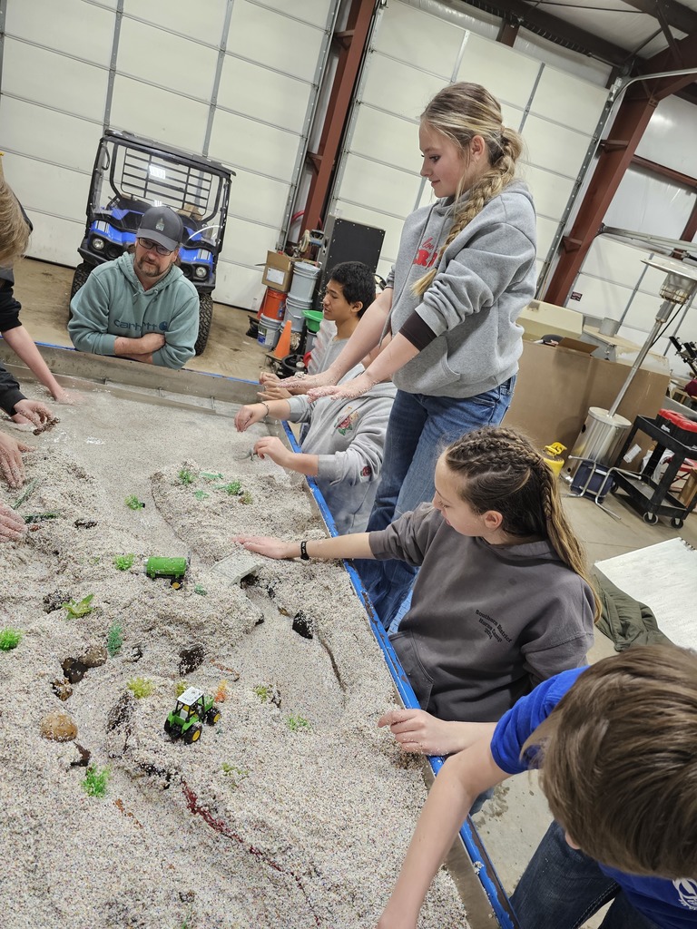 students examine hydrology table