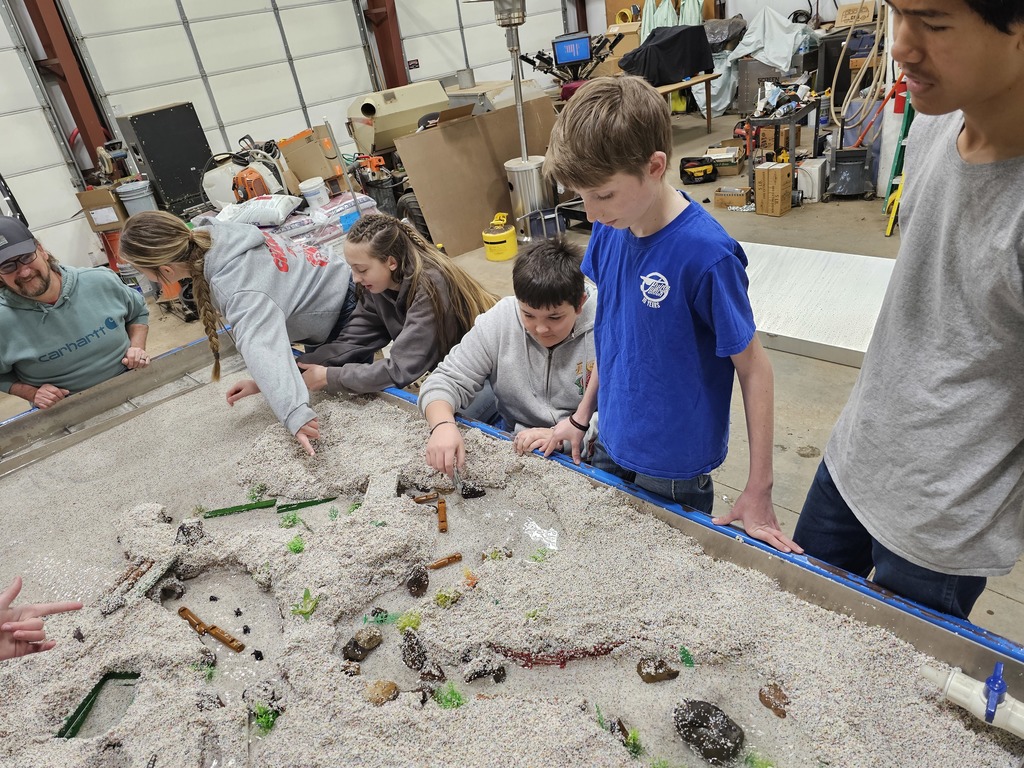 students examine hydrology table