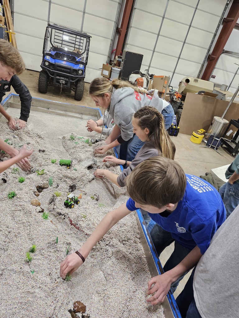students examine hydrology table