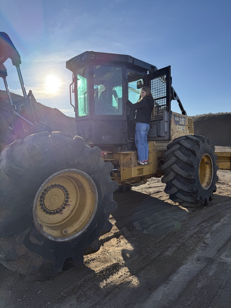 students and logging equipment