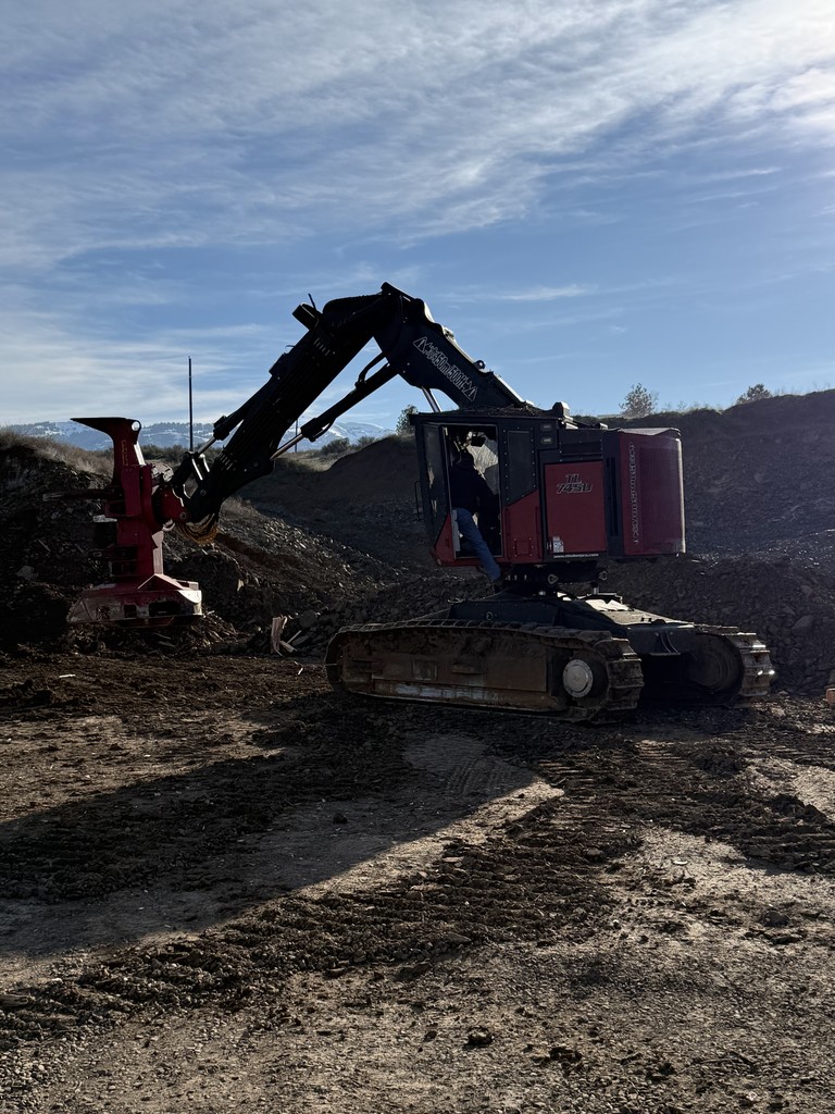 students and logging equipment