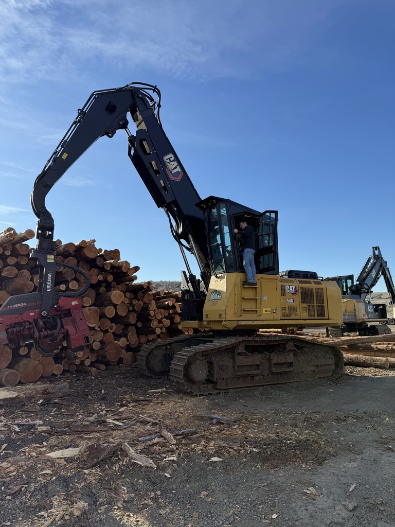students and logging equipment